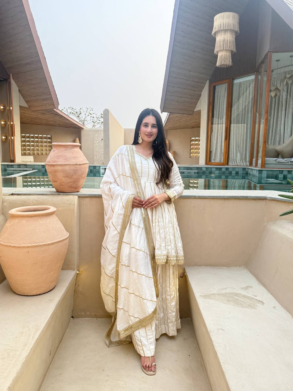 Radiant Rose Pink Flared Peplum Kurti and Sharara Set Embellished with Luminous Gold Zari Stripes and Sequined Borders